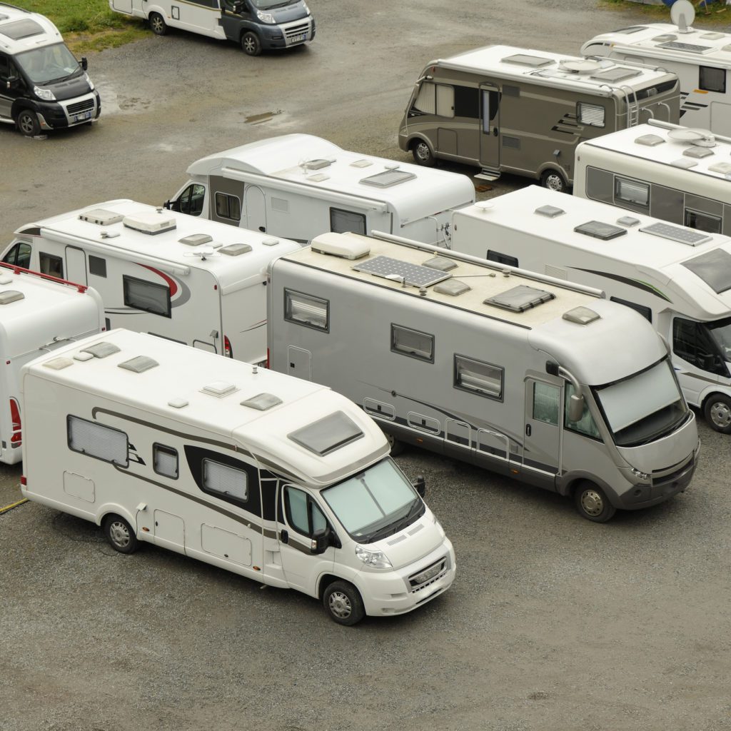 Aerial view of white RV, parked RVs